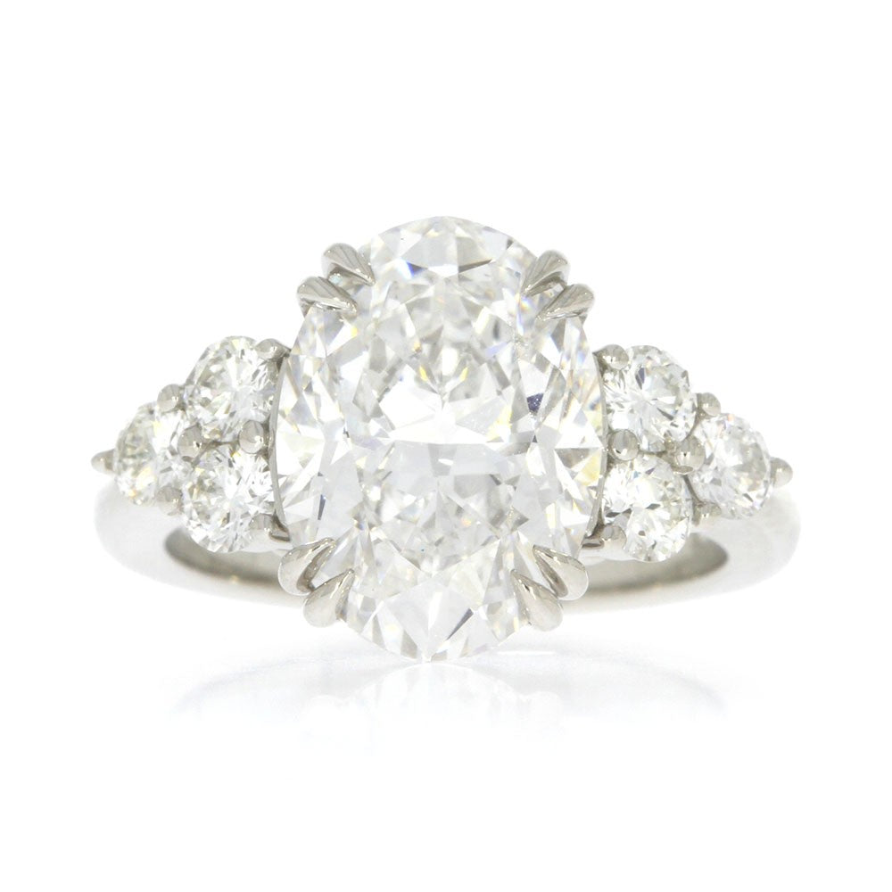 Platinum and Diamond Three Stone Style Engagement Ring, with 5.06ct Oval Diamond Center