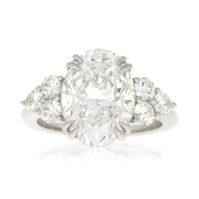 Platinum and Diamond Three Stone Style Engagement Ring, with 5.06ct Oval Diamond Center