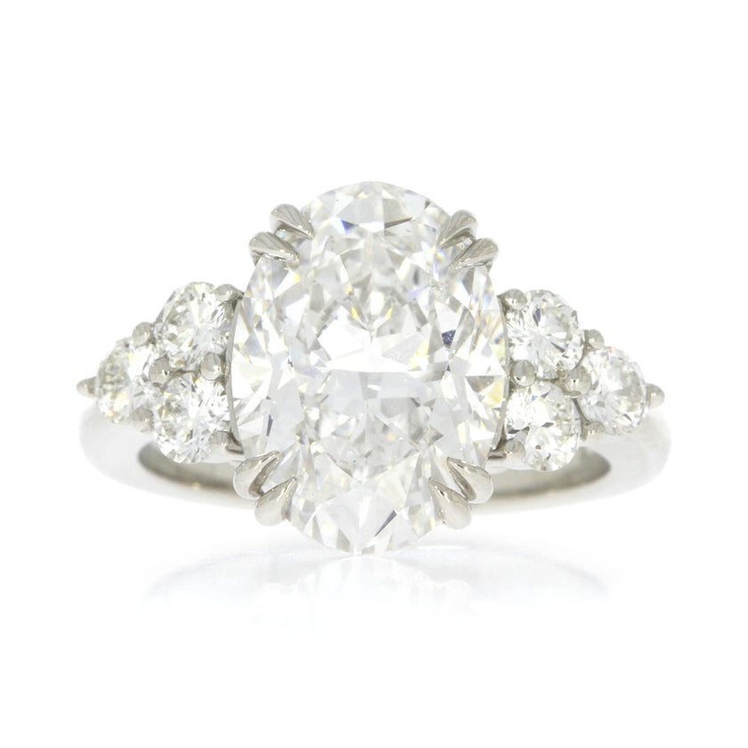 Platinum and Diamond Three Stone Style Engagement Ring, with 5.06ct Oval Diamond Center