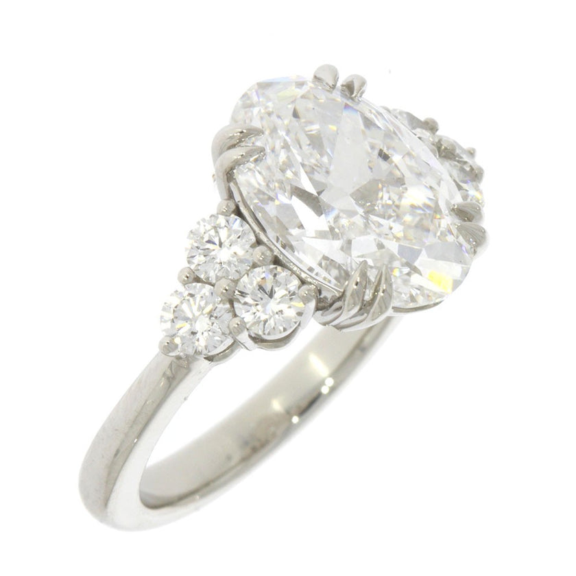 Platinum and Diamond Three Stone Style Engagement Ring, with 5.06ct Oval Diamond Center