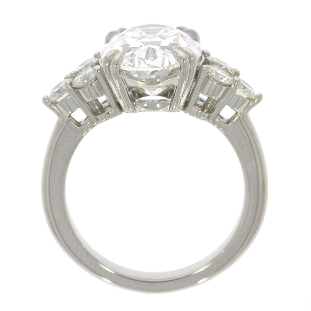 Platinum and Diamond Three Stone Style Engagement Ring, with 5.06ct Oval Diamond Center