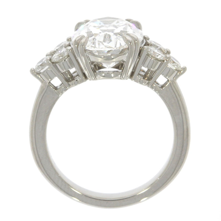 Platinum and Diamond Three Stone Style Engagement Ring, with 5.06ct Oval Diamond Center