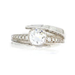 18k White Gold and Diamond Ring With Round Cut Diamond Accents Below Tall Bypass