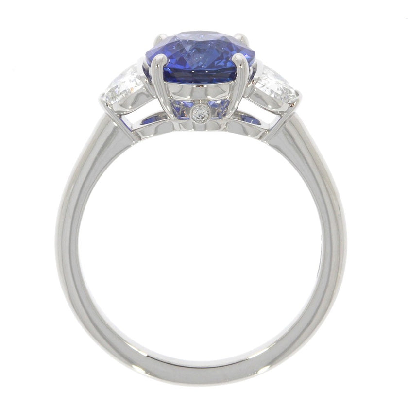 18 Karat White Gold And Oval Blue Sapphire And Half Moons Brilliant Diamonds Three Stone Ring