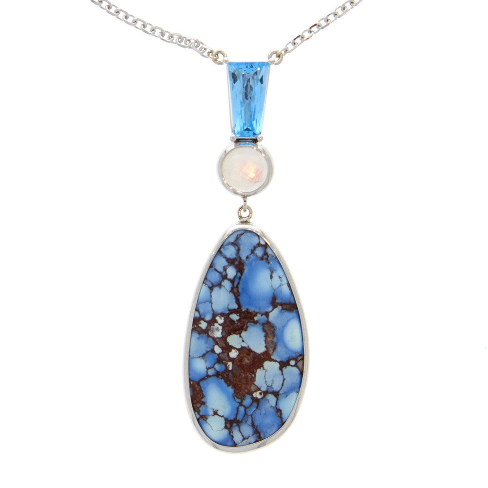14K White Gold And Kazakhstan Turquoise Teardrop And Mother of Pearl Faceted Cabachon And Faceted Trapezoid Blue Topaz Pendant In Center