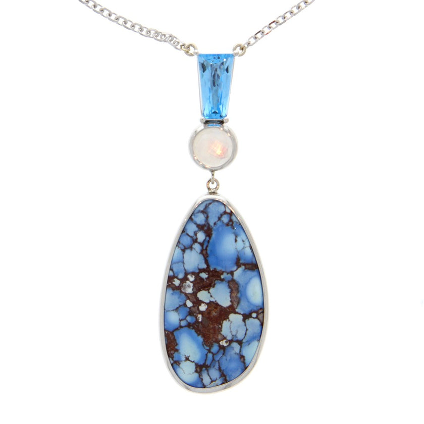 14K White Gold And Kazakhstan Turquoise Teardrop And Mother of Pearl Faceted Cabachon And Faceted Trapezoid Blue Topaz Pendant In Center