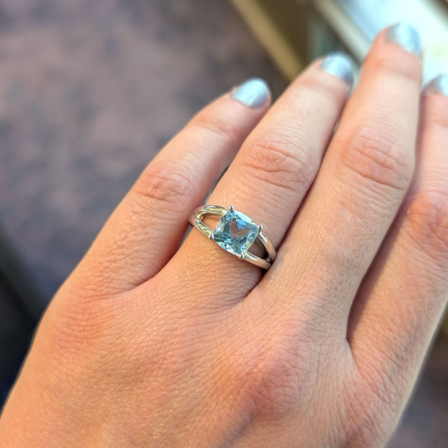 Sterling Silver Split Shank Ring with Four-Prong Set Cushion Cut Blue Topaz